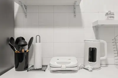 a kitchen counter with a toaster and a coffee maker at Boho Coastal Retreat with Jacuzzi, 1 min to Beach in Athens