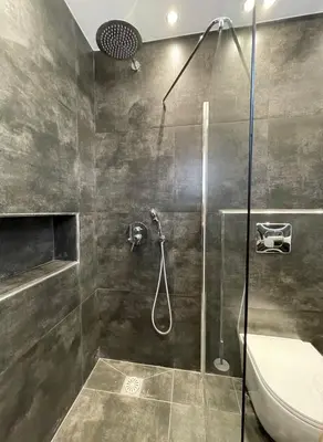 a bathroom with a shower and a toilet at Casa del Rey in Piraeus