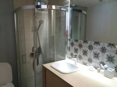 a bathroom with a sink and a shower with a shower at 7th floor bright penthouse in quiet pedestrian in Athens