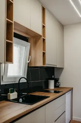 a kitchen with white cabinets and a sink at Apartment 49 Athens in Athens