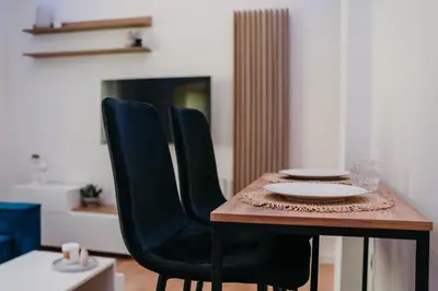 a table with two chairs and a plate on it at Apartment 49 Athens in Athens