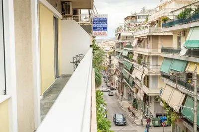 a view of a street from a balcony of a building at Elegant & Modern 2BR Apartment - Pireaus Center and Marina in Piraeus
