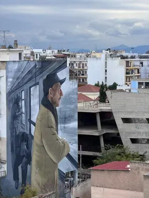 a painting of a man on the side of a building at Krezias Apartments K1 Acropolis View & Jacuzzi ! in Athens