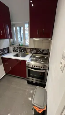 a kitchen with a stove and a sink at Krezias Apartments K1 Acropolis View & Jacuzzi ! in Athens