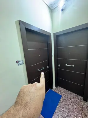 a man is opening a door in a room at Krezias Apartments ST5 Acropolis View ! in Athens
