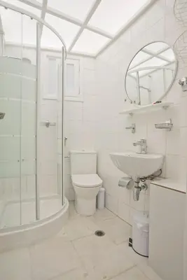 a bathroom with a shower toilet and a sink at Alex Guesthouse Stylish Studio near the Sea in Piraeus