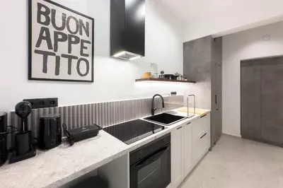 a kitchen with a sink and a counter top at Athenian Zen Suite in Athens