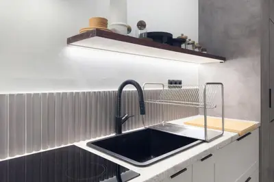a kitchen with a sink and a shelf at Athenian Zen Suite in Athens