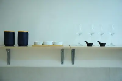 a shelf with a bunch of glasses on it at Elegant Athenian Escape near Lycabettus in Athens