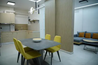 a kitchen and dining room with a table and chairs at Elegant Athenian Escape near Lycabettus in Athens
