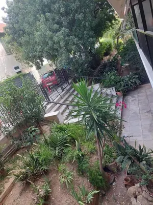 an overhead view of a garden with trees and plants at Beach side Marina Alimos apartment in Athens