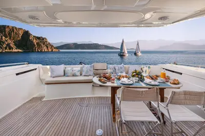 a table on a boat with food on the deck at DS MAI Sailing in Athens