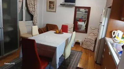 a kitchen with a table and chairs in a kitchen at Cozy Classic Residence 