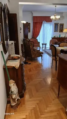 a living room with a hard wood floor and a room with at Cozy Classic Residence 