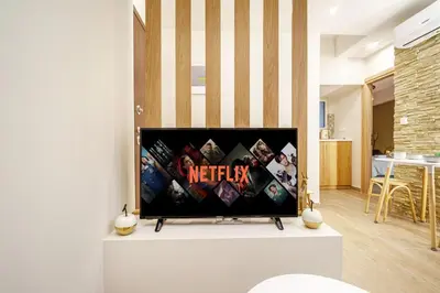 a flat screen tv sitting on top of a living room at Athens Lodge in Koukaki in Athens