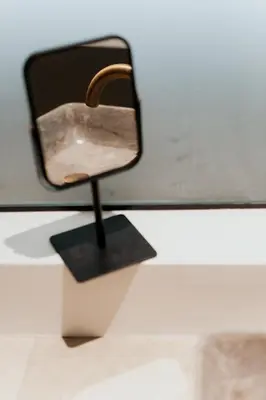 a mirror sitting on top of a table at 1BR Backyard Jacuzzi Retreat Near Acropolis in Athens