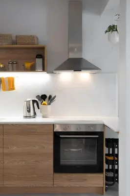 a kitchen with a stove and a sink at Elegant 2BR Apt Near Acropolis & Metro in Athens