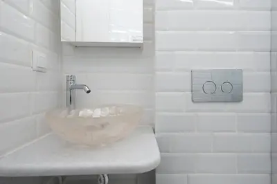 a bathroom with a bowl sink on a counter at Elegant 2BR Apt Near Acropolis & Metro in Athens