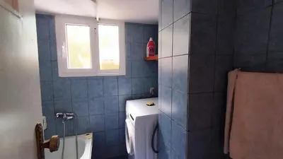 a bathroom with a toilet and a window at Kallithea Athens Star in Athens