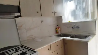 a small kitchen with a sink and a stove at Kallithea Athens Star in Athens