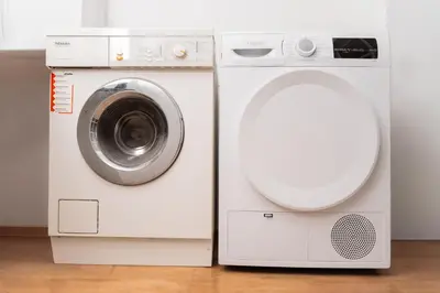 a washing machine and a dryer in a room at 1400ft Central Rooftop Gym King Bed WFH in Athens