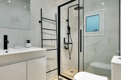 a bathroom with a shower and a toilet and a sink at CityLife apartment 2'from metaxourgio station 2B in Athens