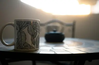 a coffee mug is sitting on a table at CityLife apartment 2'from metaxourgio station 2B in Athens