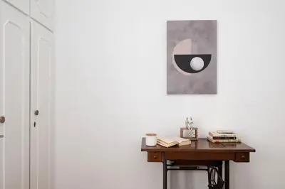 a desk in a room with a picture on the wall at PS Apartment in Athens