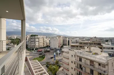 a view of a city with buildings and a street at Sunlit Terrace 3BR Apartment - Tavros by ΜΡS in Athens
