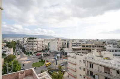 a view of a city with buildings and a street at Sunlit Terrace 3BR Apartment - Tavros by ΜΡS in Athens