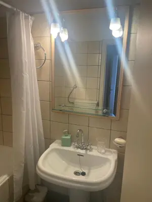a bathroom with a sink and a mirror at 45 τμ διαμέρισμα in Athens