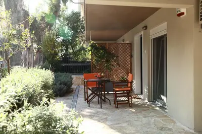 a table and chairs sitting on a patio at Harmonia in Athens