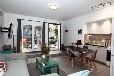 a living room with a couch and a table at Harmonia in Athens