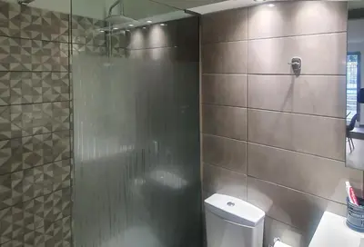 a bathroom with a shower stall and a toilet at Harmonia in Athens