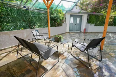a group of chairs sitting on a patio at Moschato modern cozy apartment with private yard in Piraeus