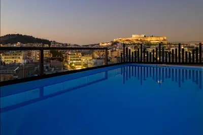 a swimming pool with a view of the city at Thea Acropolis Suites & Apartments in Athens