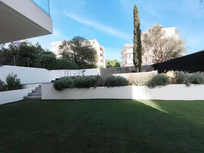 a garden with a white fence and a lawn at Athens Glyfada Luxury Loft Swimming Pool fully equipped all new in Athens