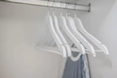 a closet with a white curtain and a white rack at Monastiraki Center Stay in Athens