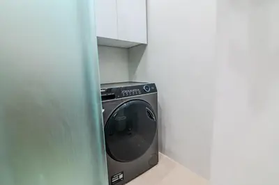 a washing machine in a corner of a room at Monastiraki Center Stay in Athens