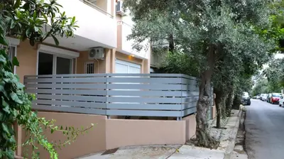 a bench on the side of a house at Luxury 1 Bd Apt with Patio in Neo Psychiko in Athens