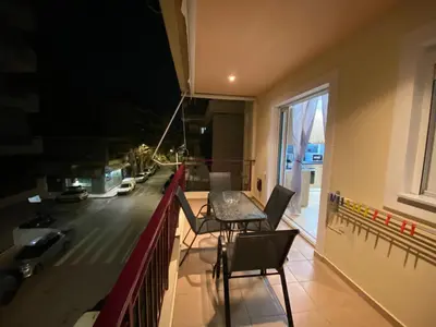 a room with a table and chairs on a balcony at Athens Luxury & Smart Center House - Free Parking - 300 Mbps Fiber Wi-Fi in Athens