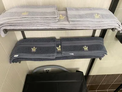 a group of towels on a shelf in a bathroom at Athens Luxury & Smart Center House - Free Parking - 300 Mbps Fiber Wi-Fi in Athens
