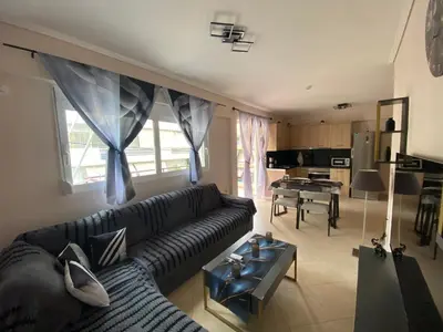 a living room with a couch and a table at Athens Luxury & Smart Center House - Free Parking - 300 Mbps Fiber Wi-Fi in Athens