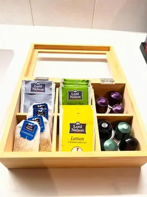 a wooden box filled with different types of food at Thymeli Cozy Apartment in Athens