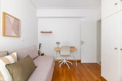 a living room with a couch and a table at The Glyfada Getaway 3BR with Balcony by UPSTREET in Athens