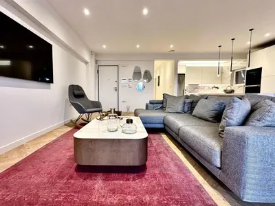 a living room with a couch and a table at Elaia Luxury Selections - Aqua Marine in Athens