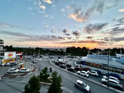 a parking lot with a lot of cars on a highway at Elaia Luxury Selections - Aqua Marine in Athens