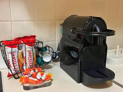 a coffee maker sitting on a counter with candy at Alimos Skyline Balcony Home in Athens