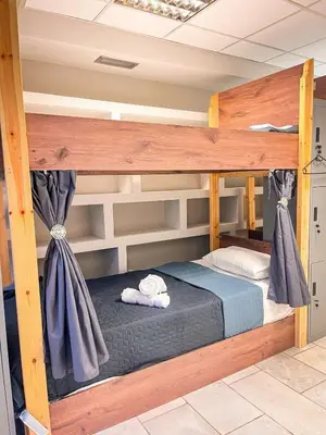 a bedroom with a bunk bed in a room at Sharing Apartment in Athens