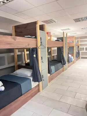 a group of bunk beds in a room at Sharing Apartment in Athens